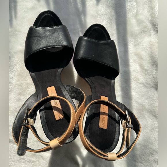 The sandals are high heeled, with a black, beige and white color combination. - Picture 4 of 8